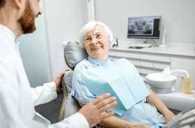 Patient with dentures in Framingham   