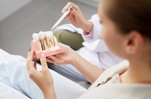 Dentist and patient discussing ways to prevent dental emergencies