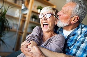 couple smiling while holding each other
