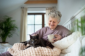  A female patient smiling after dental implant surgery