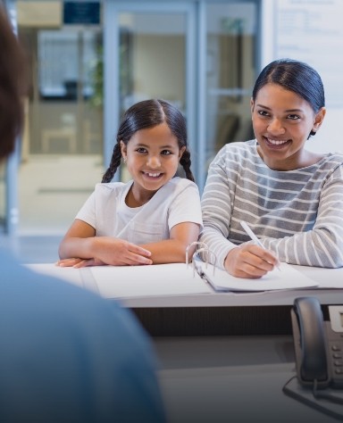 Dental patients checking in at dental office