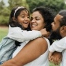 Family smiling together after preventive dentistry visit