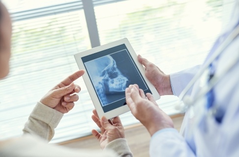 Dentist's examining x-rays during children's dentistry visit