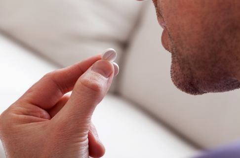 Dental patient taking oral conscious dental sedation pill