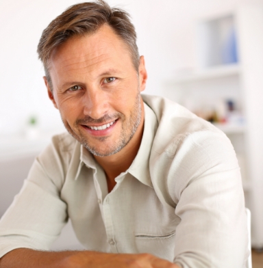 Man with healthy smile after periodontal therapy